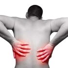 Ноющая боль в пояснице: почему возникает, где искать причину и способы лечения